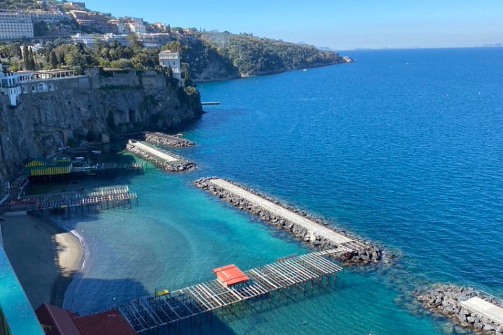 a large body of water with a city in the background