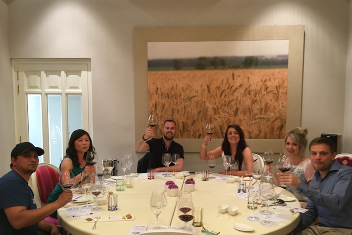 a group of people sitting at a dinner table