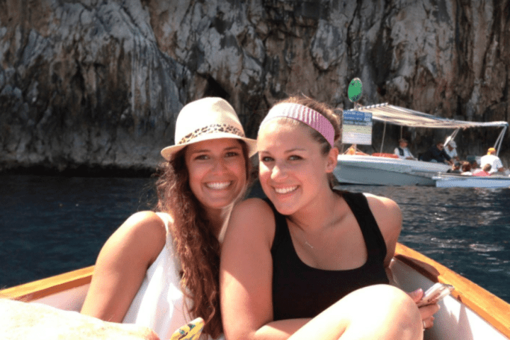 a woman sitting on a boat in the water