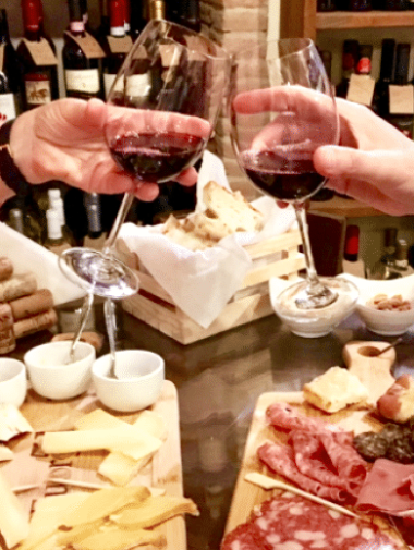 a person sitting at a table eating food