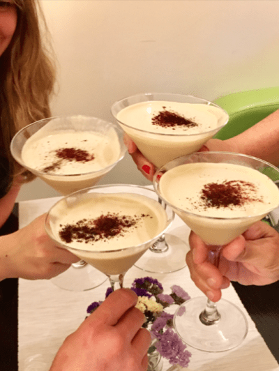 a woman sitting at a table with a plate of food
