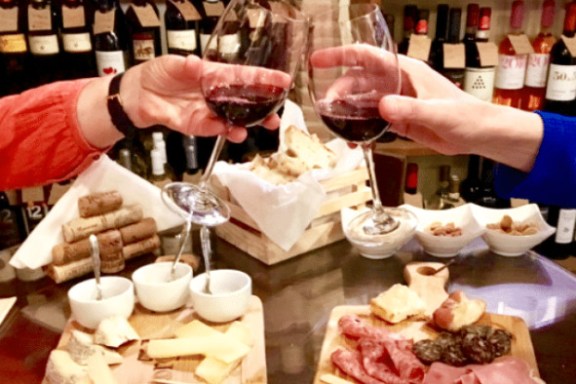 a person sitting at a table eating food